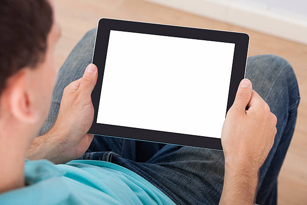 istock Man Looking At Blank Screen Of Digital Tablet 507242779