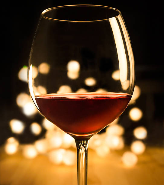 istock Red wine in the glass. Romantic Christmas dinner 507242971
