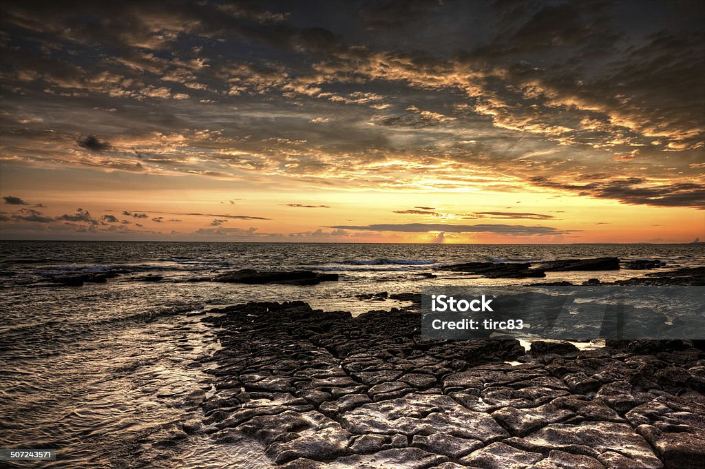 Dramatic sunset off the Heritage Coast of South Wales Beach Stock Photo