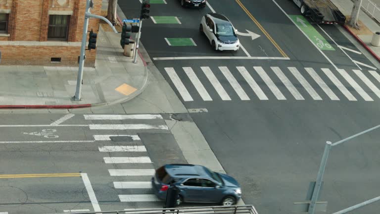 Pedestrian crosswalk and electric car downtown Los Angeles