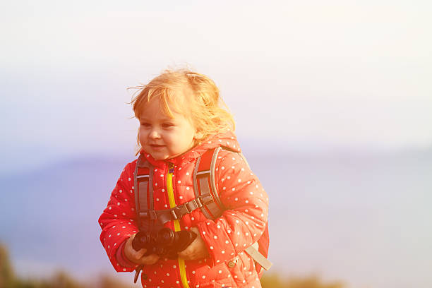 istock little tourist with binoculars travel in mountains 507246710