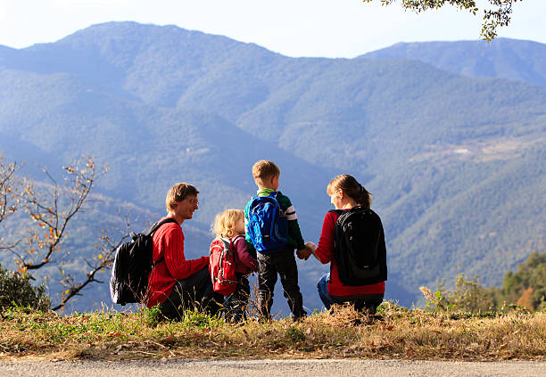 istock family with two kids hiking in mountains 507246830