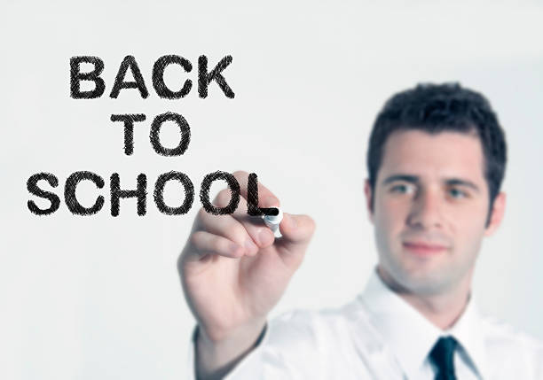 istock Businessman writing back to school 507247164