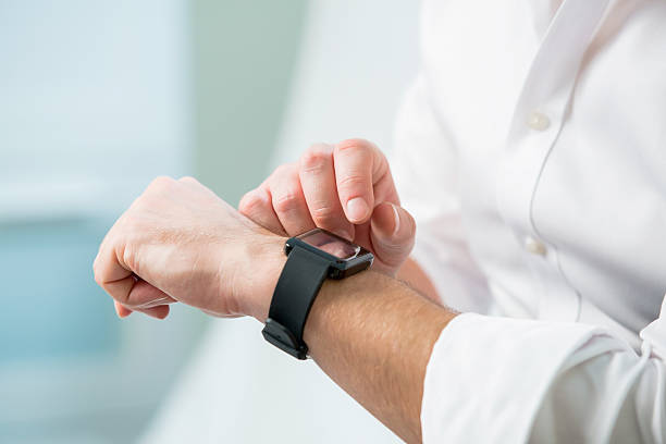 istock Close up of man hands with smart watch 507248656