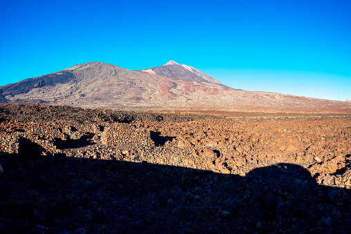 Volcanic landscape with car shadow on Teide park on Tenerife isalnd