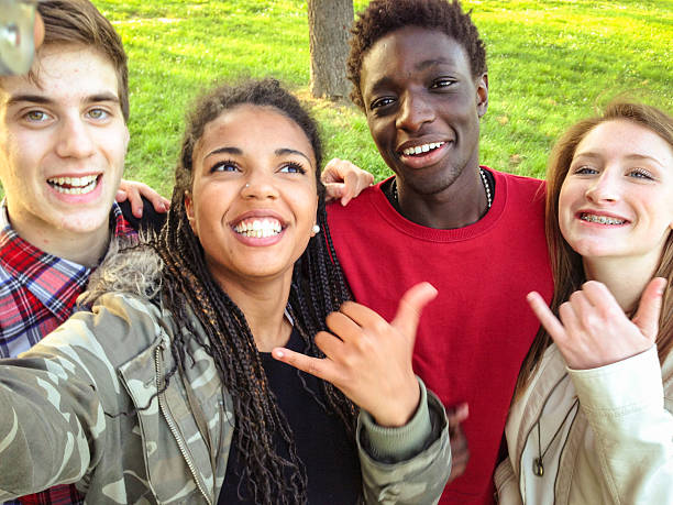 istock Group of college student laughing and doing a selfie 507249610