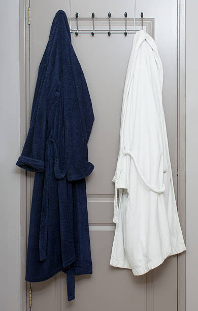 istock dressing gown on a clothes rack inside door 507252124