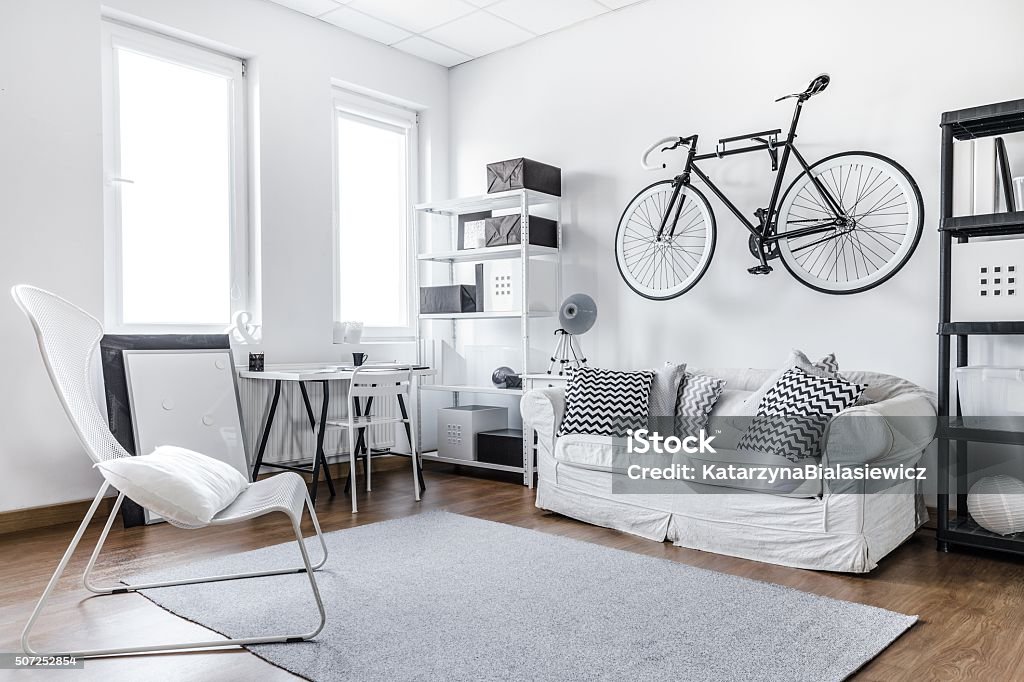 Black and white studio room Black and white studio room of young hipster Bachelor Stock Photo