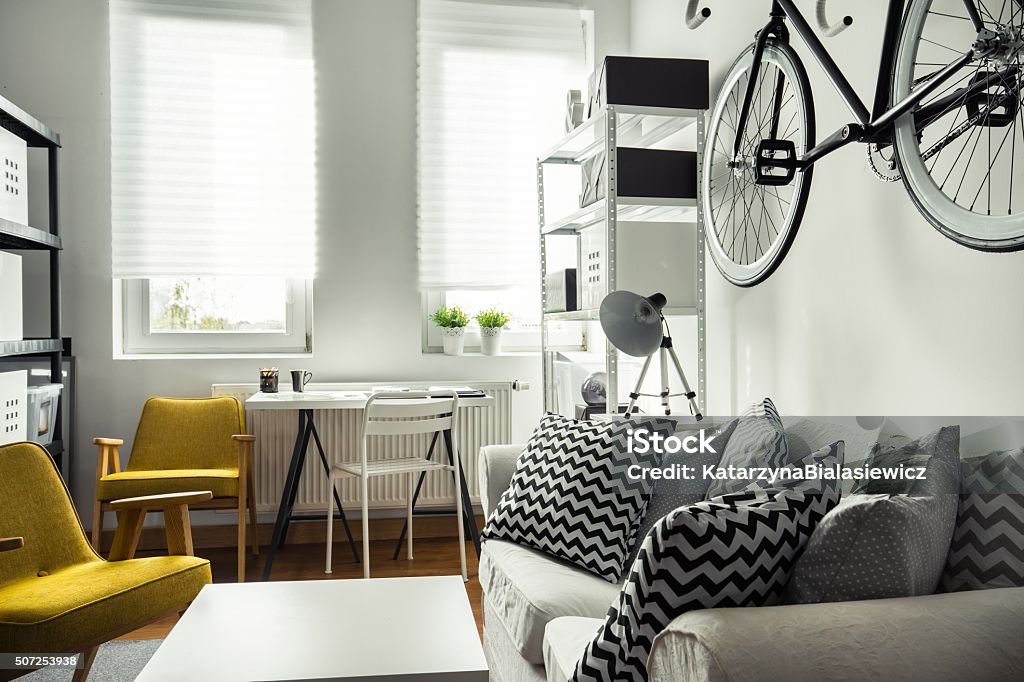 Trendy hipster's space Trendy hipster's space with smart place for bike Apartment Stock Photo
