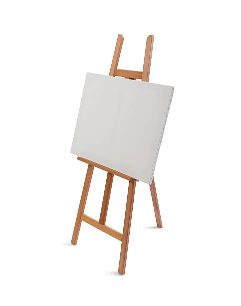 istock White painter canvas on wooden easel isolated on white 507254694