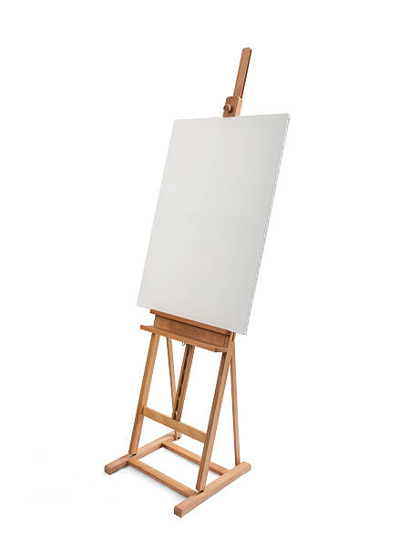 istock White painter canvas on wooden easel isolated on white 507255000