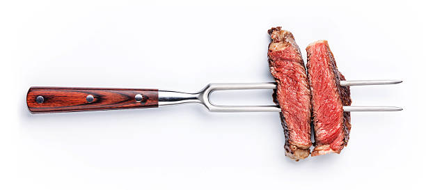 tranches de steak sur la viande fourche - steak photos et images de collection