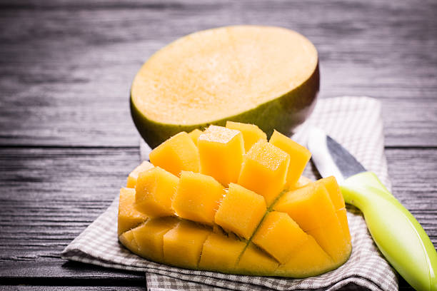 istock Fresh rip mango on a wooden background.Healthy food 507255592