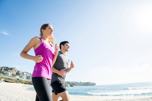 istock Young couple running outdoors 507257710
