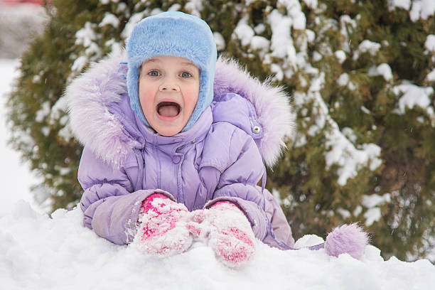 istock Girl lying in a snowdrift snow 507258104