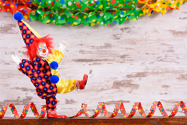 istock clown with paper streamer at carnival 507258116