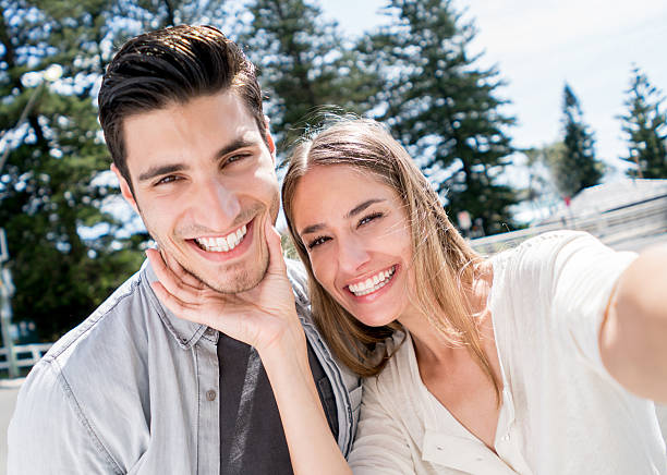 istock Young couple taking a selfie 507259570