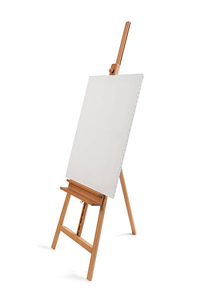 istock White painter canvas on wooden easel isolated on white 507261800