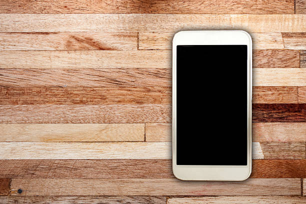 istock White smart on wooden desk 507267235