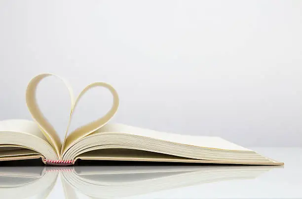 Photo of Heart shape from open book page