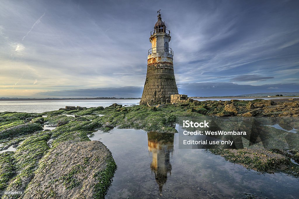 Plover Scar Lighthouse, Near Glasson Dock Lancaster, United Kingdom - June 30, 2014: Plover scar lighthouse at dusk with its reflection in a rock pool. Morecombe Bay Stock Photo