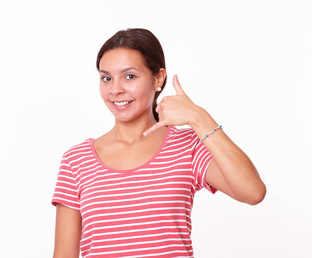 istock Pretty latin girl with call gesture 507270525