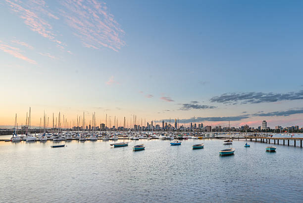 istock St Kilda harbour pier sunset with Melbourne city background 507271255