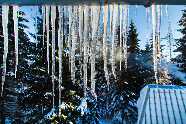 istock Winter or spring background with bright transparent icicles in the 507271296