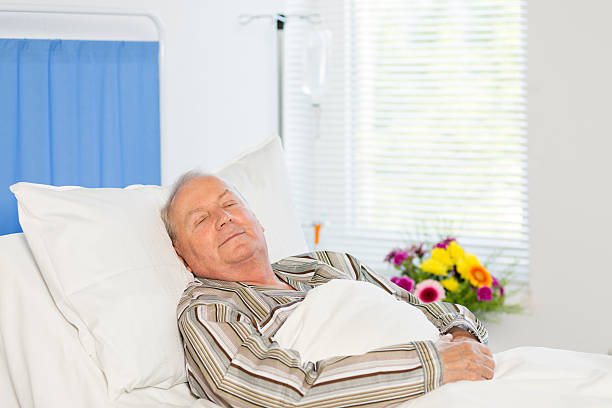 istock Senior man in hospital bed 507272447