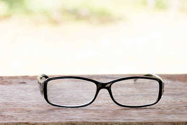 istock black glasses on old  wood table 507272672