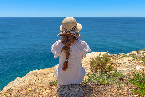 istock Tourist enjoying the ocean view from a cliff 507273515