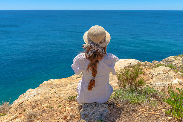 istock Tourist enjoying the ocean view from a cliff 507273531