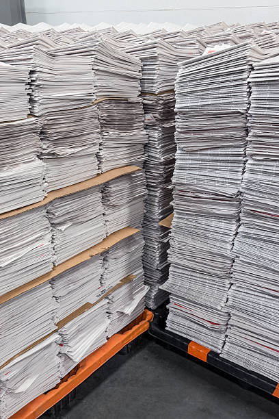istock Vertical Stacks of Newspapers on Pallets 507276114