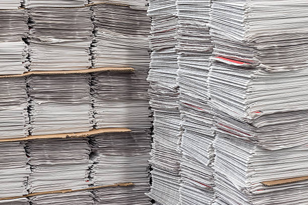 istock Stacked Bundles of Newspapers 507276680