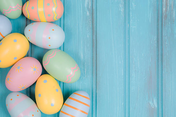 istock Easter eggs on blue wood. Seasonal background frame. 507277092