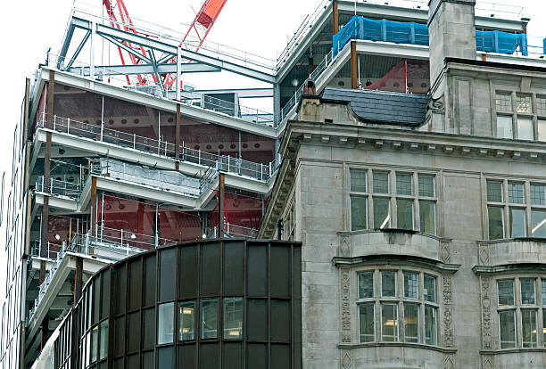 istock New construction behind old building in London England 507278764