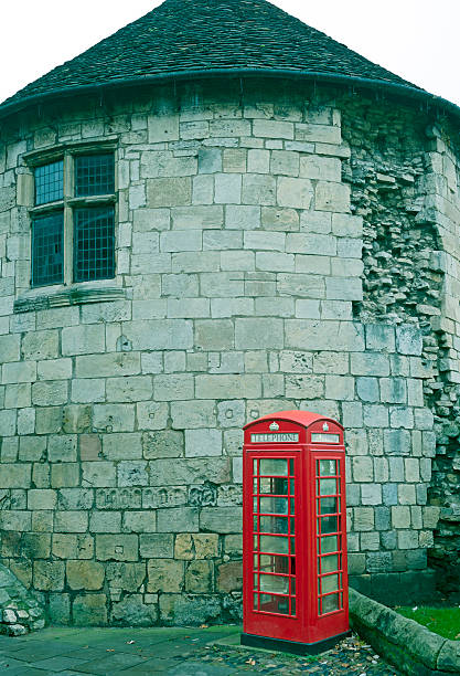 istock Phone booth and Roman tower in York England 507281024