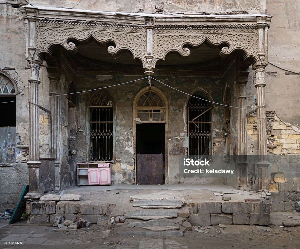 Facade of an abandoned house, Cairo, Egypt Facade with Door and two window of an abandoned house, Cairo, Egypt Abandoned Stock Photo