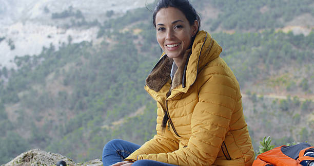 istock Smiling young woman hiking in the mountains 507282016
