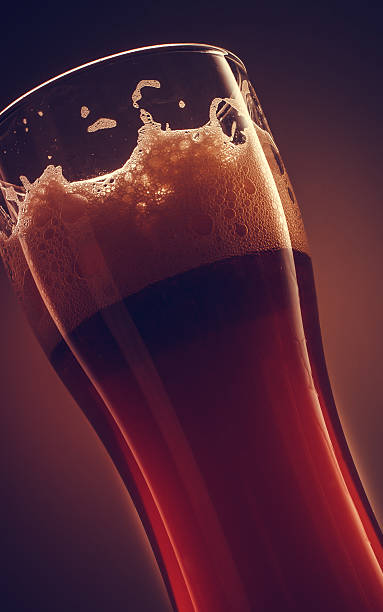 istock Glass of beer with foam 507284336