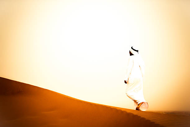 istock On a hot summer day an Arab walking the dunes 507284370