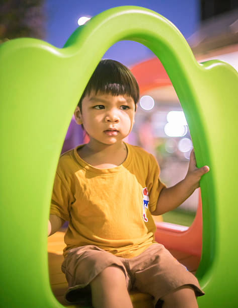 istock Asian Baby boy in a Plastic Slide playground 507285890