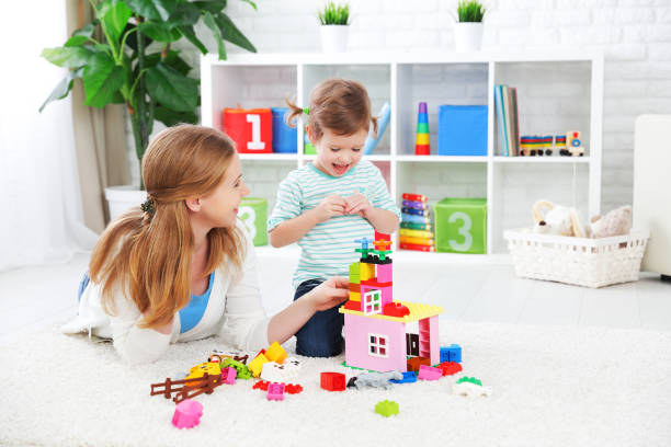 istock Mother and child daughter playing, build from constructor 507286014