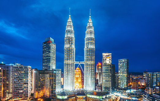 A cityscape with Petronas towers of the downtown area of Kuala Lumpur, capital city of Malaysia