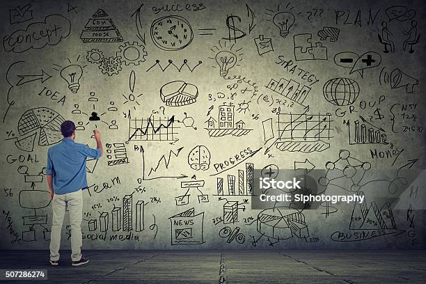 Business Man Entrepreneur Writing New Project Calculations Stock Photo - Download Image Now