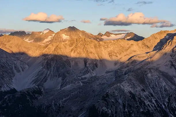 The mountain Vertainspitze (Italian: Cima Vertana; 3.545 m; middle-left) part of the Laaser mountains at sunset in the Ortler Alps in South Tyrol, Italy.