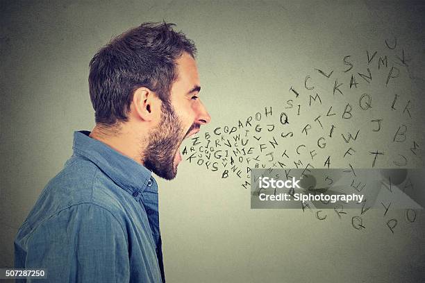 Angry Man Screaming Alphabet Letters Flying Out Of Open Mouth Stock Photo - Download Image Now