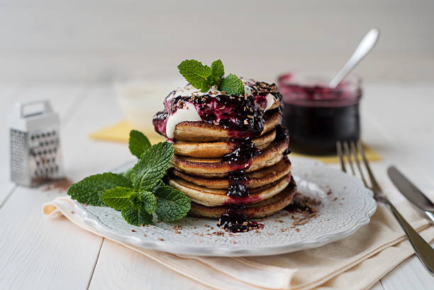Pancakes with jam and sour cream