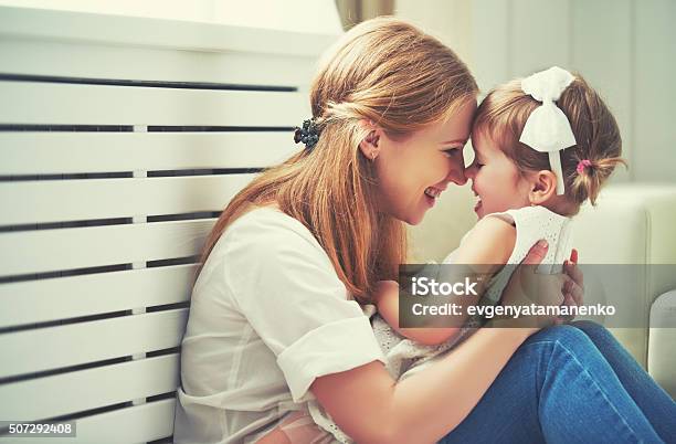 Happy Loving Family Mother And Child Playing Kissing And Hugg Stock Photo - Download Image Now