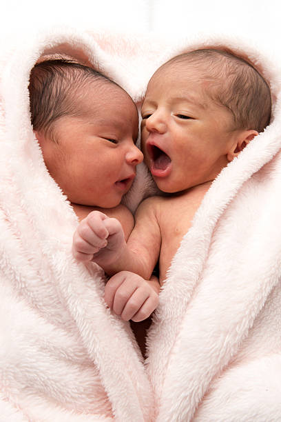 Newborn Babies Two hispanic or middle eastern newborn babies posing together half dressed girls pictures stock pictures, royalty-free photos & images